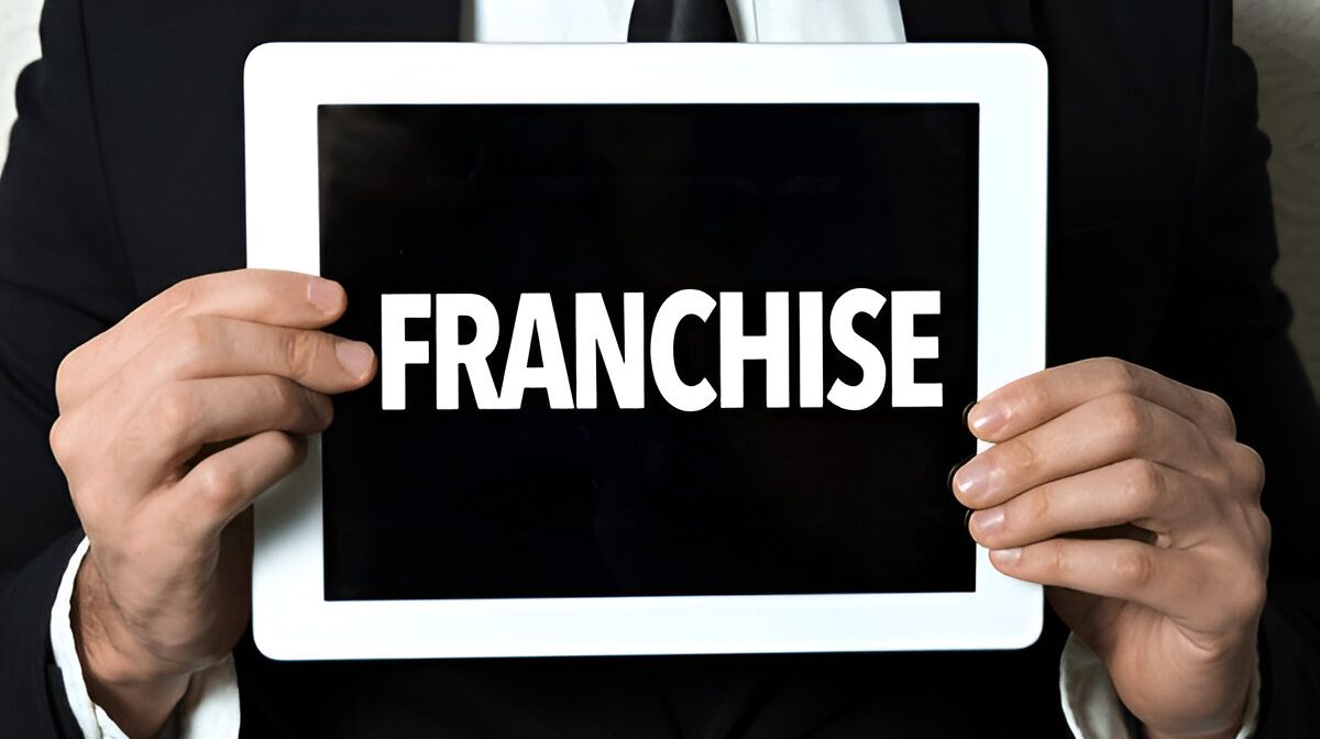 steptodown.com446717 what is a franchise man holding the slogan